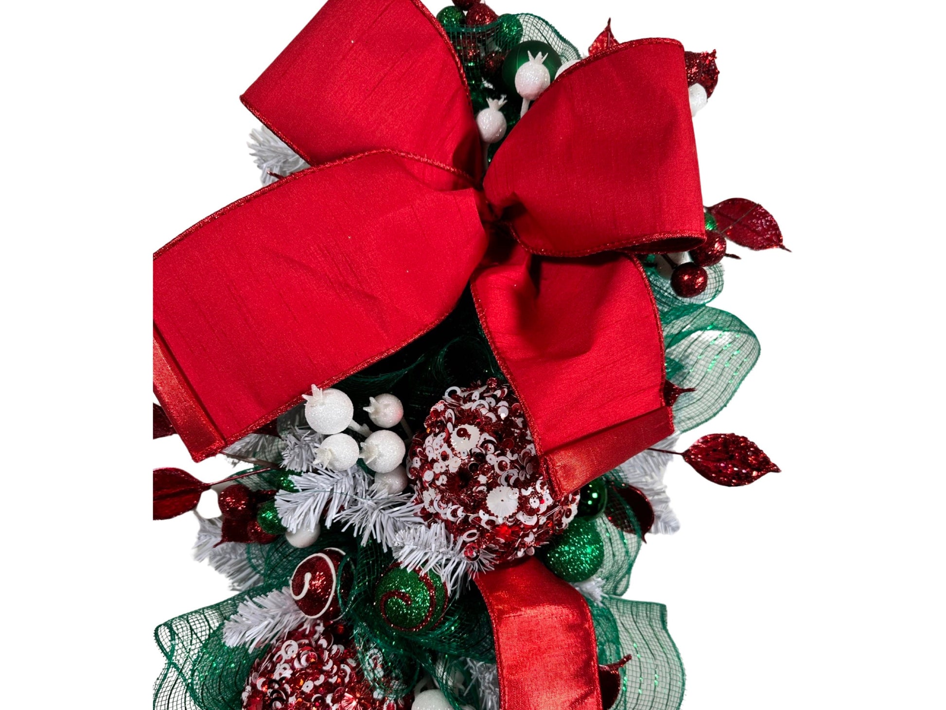elegant red and white Christmas swag featuring luxury ribbon and luxury embellishments. Swag for Christmas, swag for December