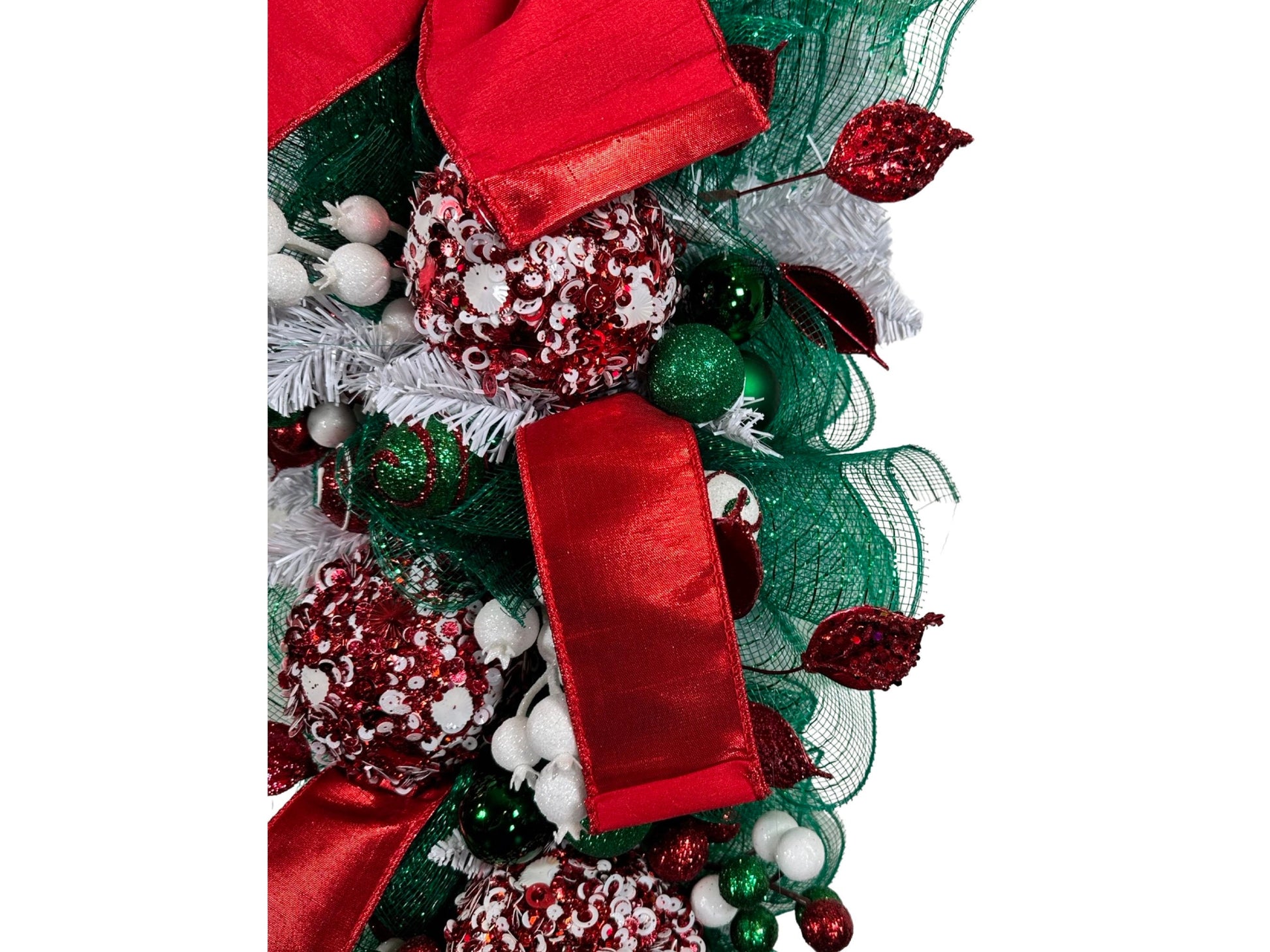 elegant red and white Christmas swag featuring luxury ribbon and luxury embellishments. Swag for Christmas, swag for December