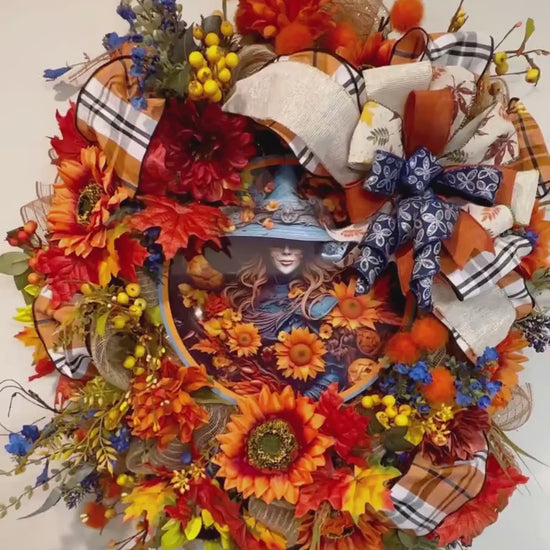 blue and orange floral witch fall and halloween wreath